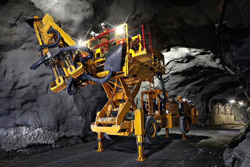 A picture of the battery electric underground roof bolter in a mine