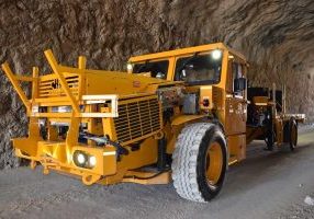 A picture of MEDATech's EV Boom Truck. A battery powered electric mine truck